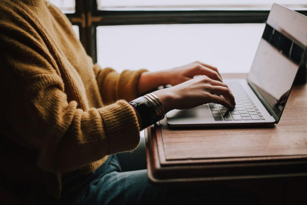 Image of person at laptop before image resize at a file size of 3MB